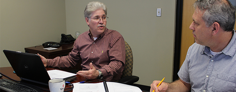 Jeff Sili speaks with a student